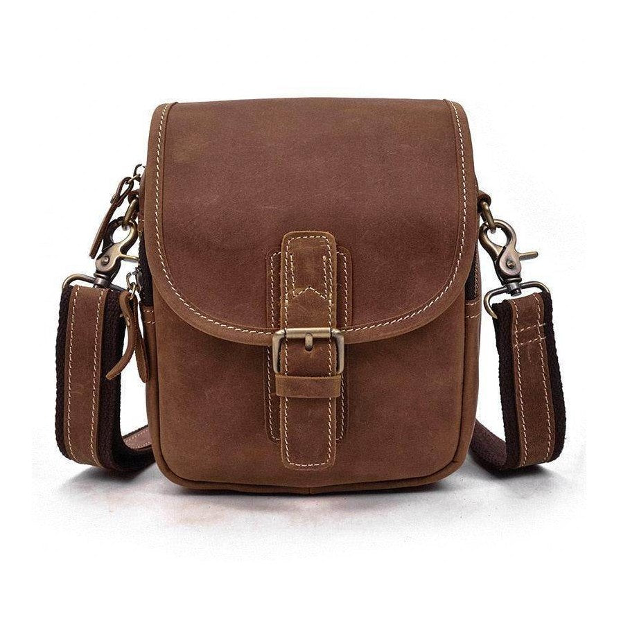 Brown leather messenger bag with adjustable strap and vintage buckle design for everyday use