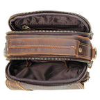 Interior view of a brown leather messenger bag with multiple zippered compartments for organized storage