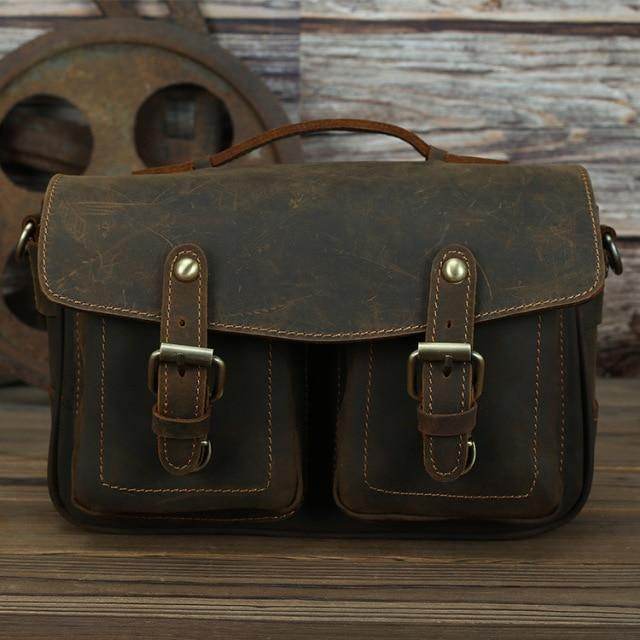 Brown leather messenger bag for photography with dual front pockets and adjustable strap