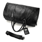 VacationGrabs leather overnight duffel bag in black with adjustable strap and luggage tag