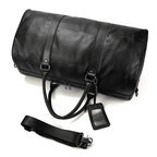 VacationGrabs leather overnight duffel bag in black with adjustable strap and luggage tag
