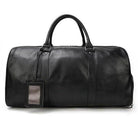 Stylish black leather overnight duffel bag with sturdy handles for travel and weekend getaways
