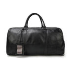 Stylish black leather overnight duffel bag with sturdy handles for travel and weekend getaways
