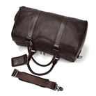 Spacious leather overnight duffel bag with sturdy handles and adjustable shoulder strap