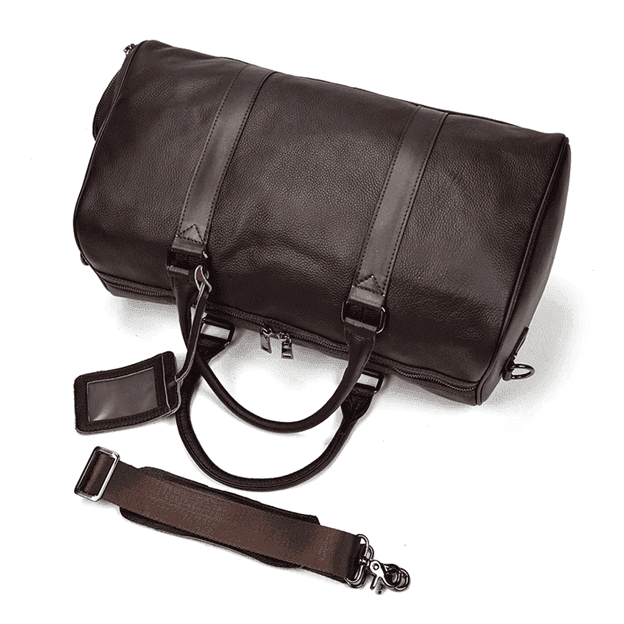 Spacious leather overnight duffel bag with sturdy handles and adjustable shoulder strap