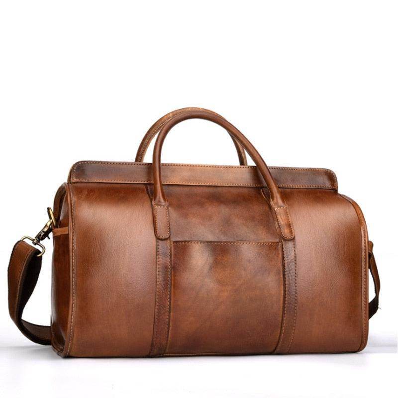 Brown leather shoulder bag for travel with sturdy handles and adjustable strap
