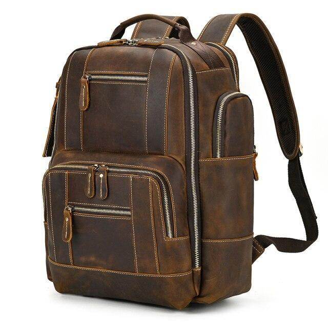 Leather style travel backpack by VacationGrabs with multiple compartments and a sleek design