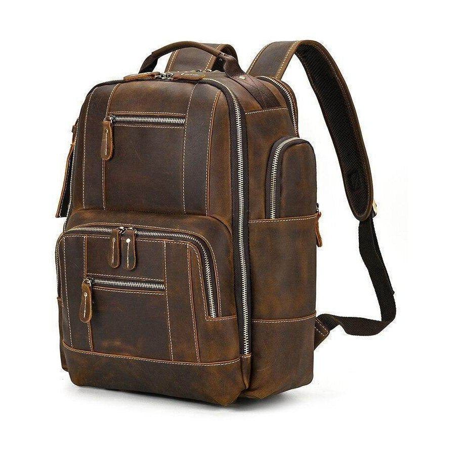 Leather style travel backpack with multiple compartments and sturdy straps for easy carrying