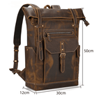 Brown leather style travel backpack with multiple pockets and adjustable straps for convenient travel