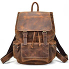 Brown leather travel backpack from VacationGrabs featuring adjustable straps and multiple pockets