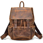 Brown leather travel backpack from VacationGrabs featuring adjustable straps and multiple pockets