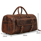 Leather weekend bag with shoulder strap featuring multiple zippers and durable handles for stylish travel