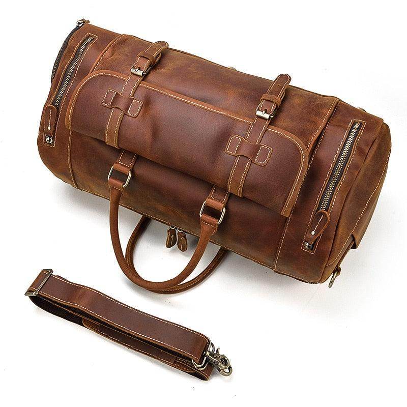 Stylish leather weekend bag with shoulder strap featuring sturdy zippers and handles for easy travel