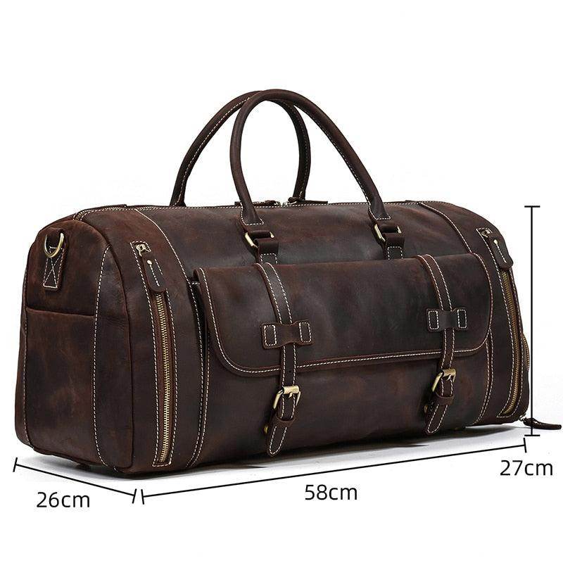 Brown leather weekend bag with shoulder strap, featuring multiple pockets and sturdy handles