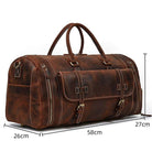 Leather weekend bag with shoulder strap featuring spacious design and multiple compartments for travel