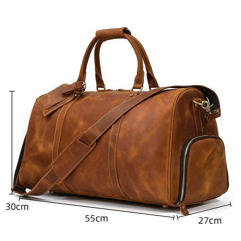 Leather weekend bag with shoulder strap featuring a spacious design and durable zippers for travel.