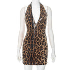 VacationGrabs leopard print mini dress with halter neck and sequin detailing on mannequin