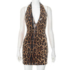 VacationGrabs leopard print mini dress with halter neck and sequin detailing on mannequin