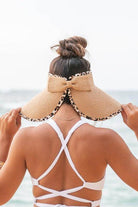 Aili's Corner leopard print sun visor with a stylish bow, perfect for sunny beach days