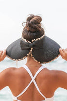 Aili's Corner leopard print sun visor with a stylish bow, perfect for sunny outdoor activities