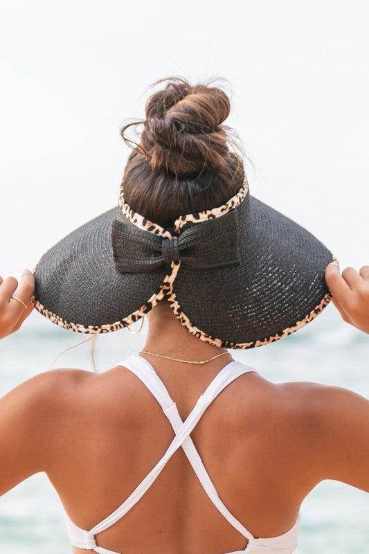 Aili's Corner leopard print sun visor with a stylish bow, perfect for sunny outdoor activities