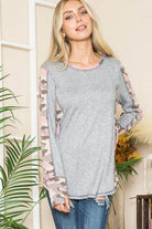Stylish women's top featuring leopard print thumbhole knit sleeves and a comfortable gray body