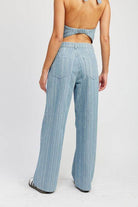 Back view of Emory Park light blue pinstripe wide leg pants with a relaxed fit and stylish design