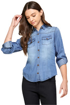 Blue Age lightweight denim shirt for travel with button front and rolled sleeves on woman