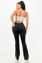 Back view of women wearing lightweight flare jeans for women with a fitted top and sleek design