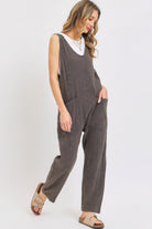 Lightweight travel jumpsuit for women in gray with pockets, perfect for stylish vacations