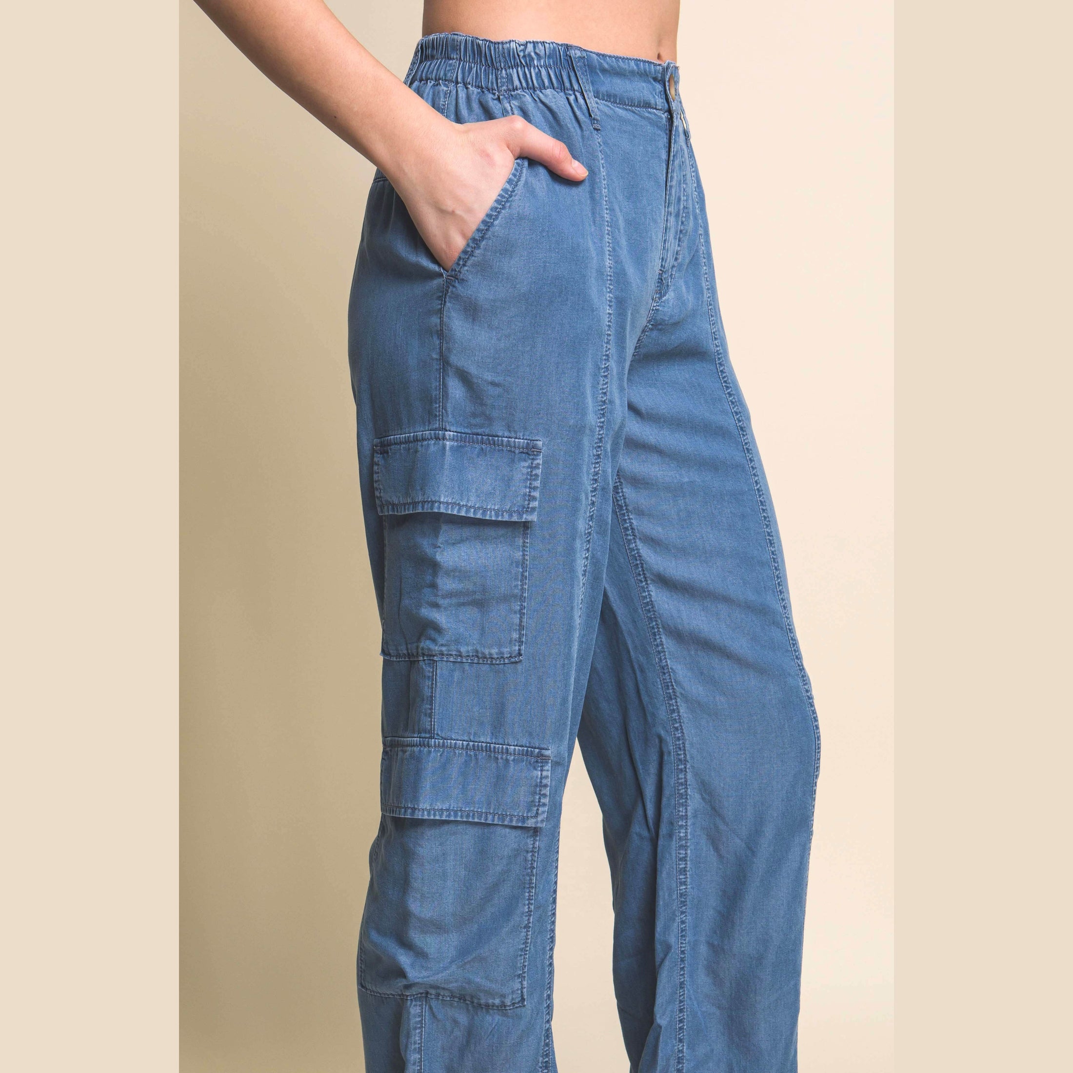 VacationGrabs women's lightweight travel pants with pockets in denim blue featuring cargo pockets and elastic waistband