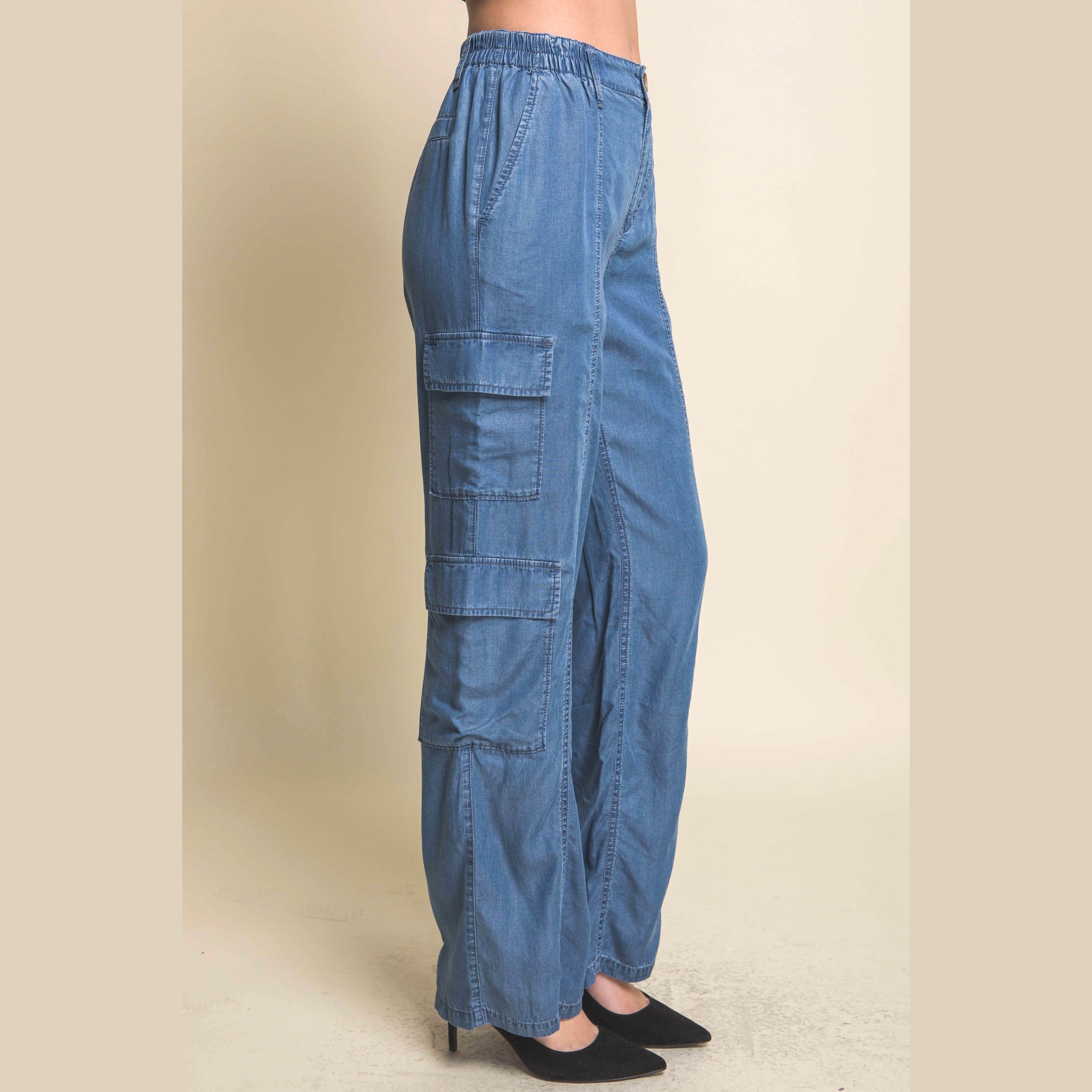 VacationGrabs women's lightweight travel pants with pockets in blue featuring cargo side pockets and elastic waistband