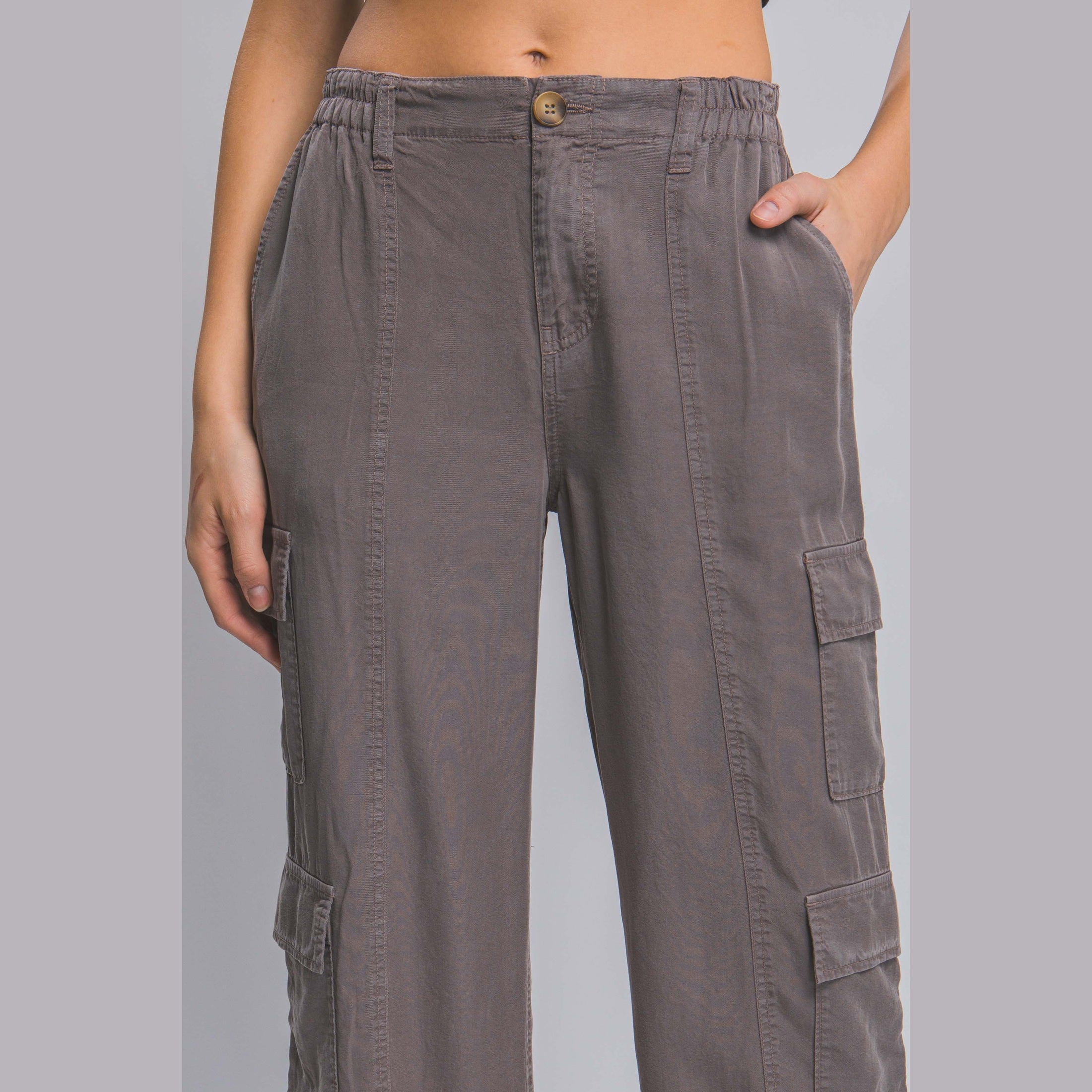 Women's lightweight travel pants with pockets in gray from VacationGrabs featuring cargo pockets and elastic waistband