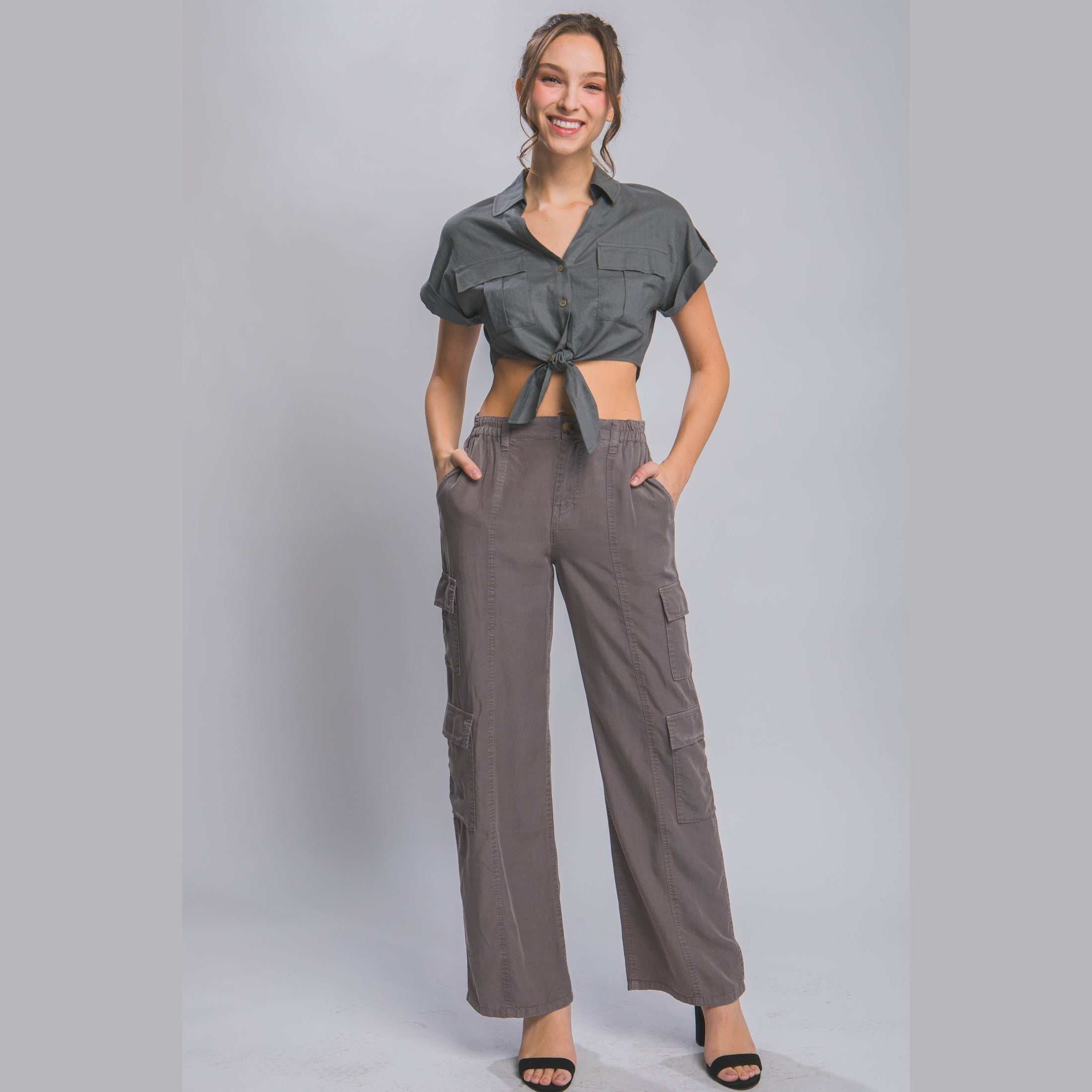 Women wearing lightweight travel pants with pockets in gray cargo style by VacationGrabs