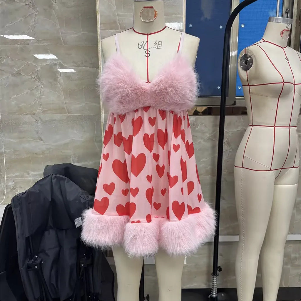 Pink heart-patterned lingerie for women with fluffy trim, perfect for romantic occasions
