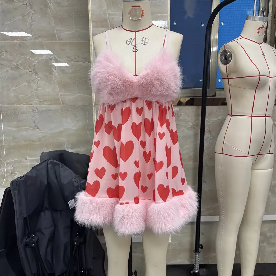 Pink heart-patterned lingerie for women with fluffy trim, perfect for romantic occasions