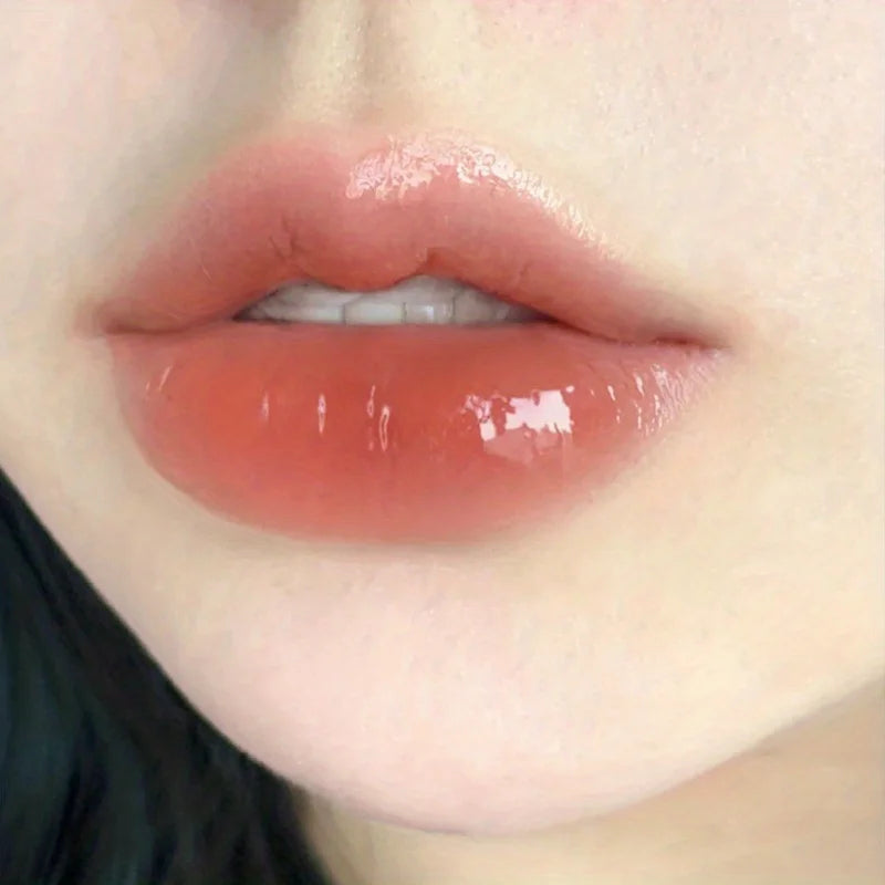 Lip gloss in soft peach shade for a glossy finish