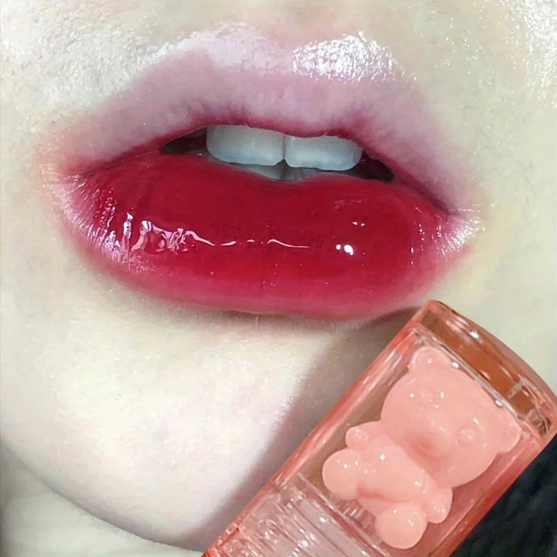Red lip gloss with cute bear-shaped container for a glossy finish