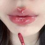 VacationGrabs lip gloss in soft pink, perfect for a shiny finish