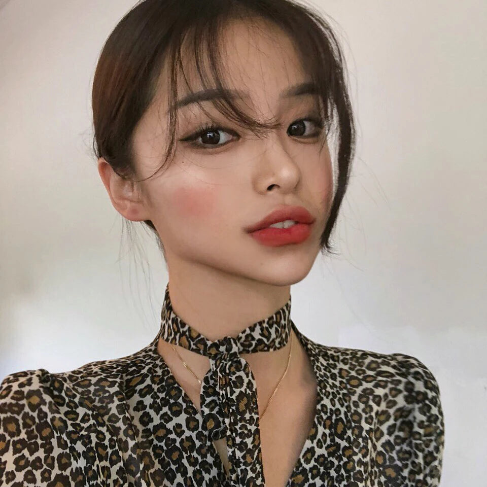 Model showing lips with lip liner in a natural makeup look