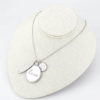 Rhodium brushed brass necklace featuring circular pendants with love inscription for stylish women