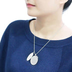 Rhodium brushed brass necklace with unique pendant design suitable for casual outfits