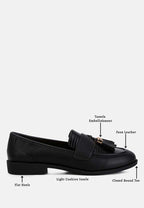 Women's black faux leather loafers with tassel embellishment and flat heels