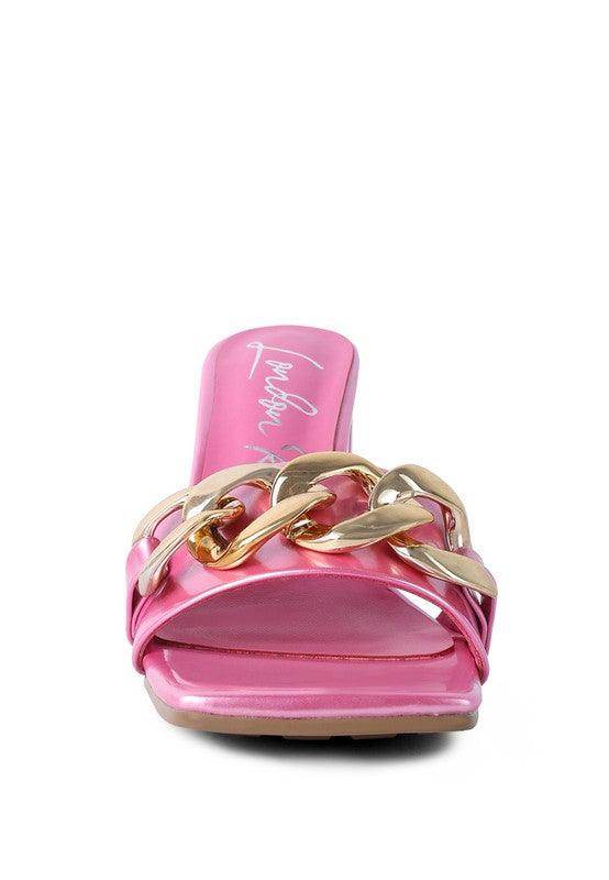 Stylish pink block heel sandals for women featuring a trendy gold chain detail