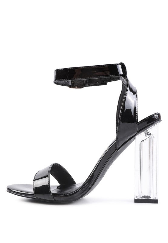 Chunky clear high heeled sandals in black for stylish women's outfits