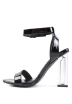 Chunky clear high heeled sandals in black for stylish women's outfits