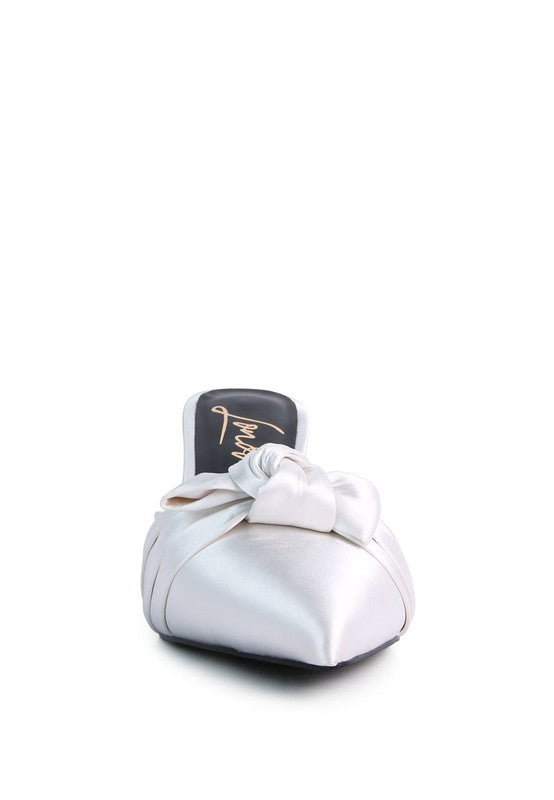 Women's white satin high heeled mule sandals with a bow detail
