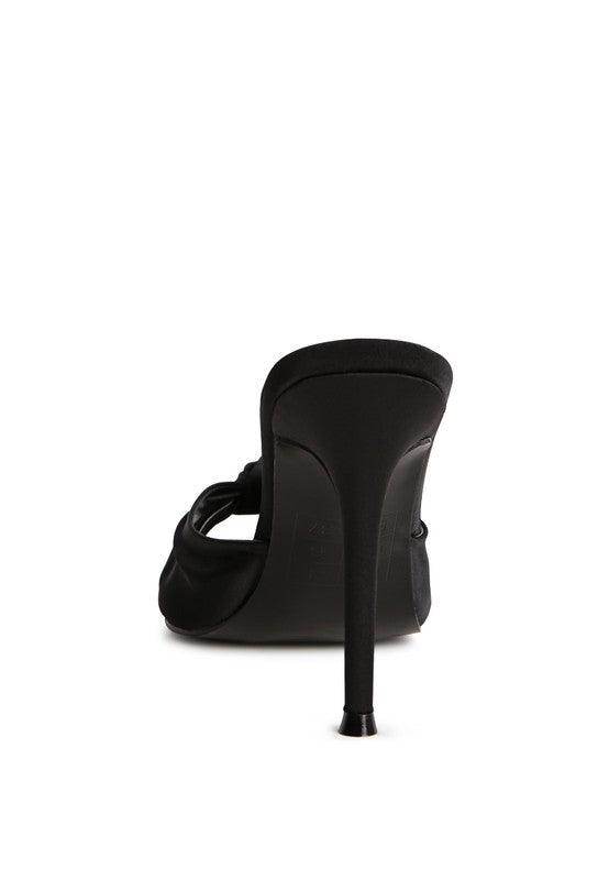 Black vacation high heeled sandals with a sleek design and elegant stiletto heel