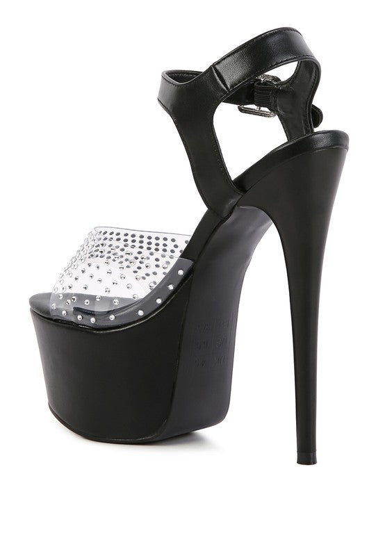 Women's clear ultra high heel sandals with black accent and studded detail
