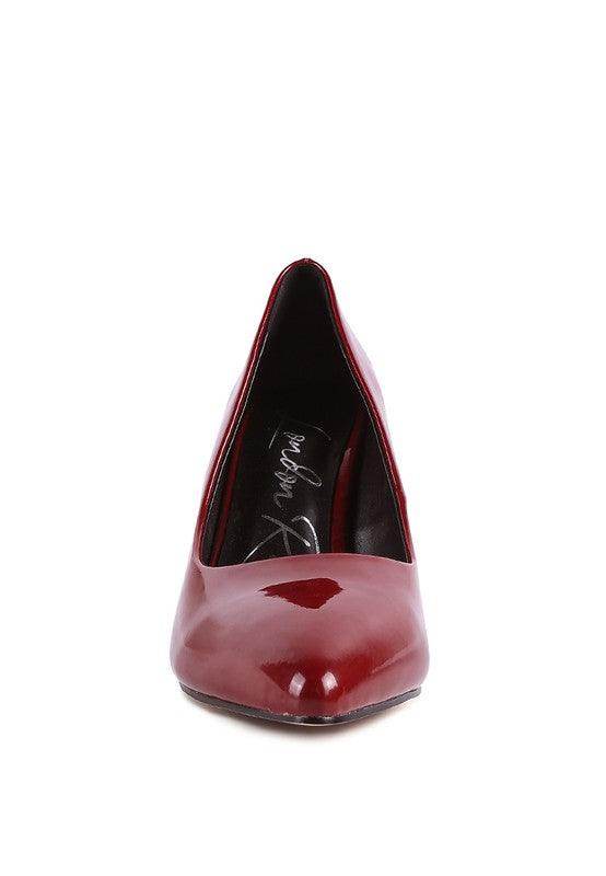 Elegant black pumps for women designed with a sleek, modern silhouette and a glossy finish
